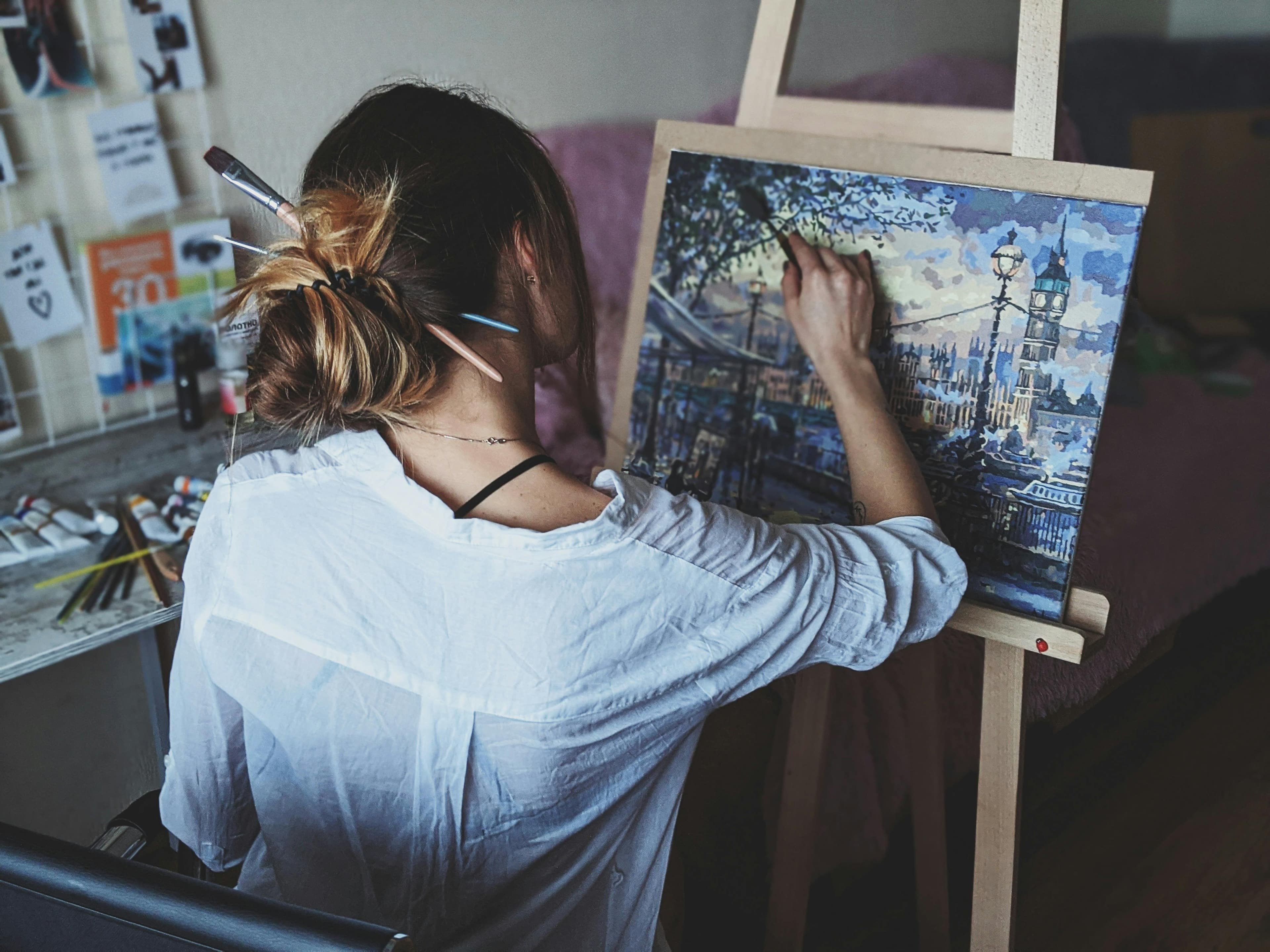 Artist painting on a canvas